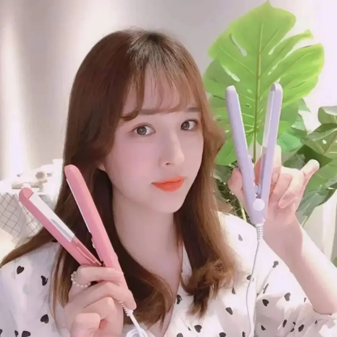 Cute Girl Holding Colorful Mini Hair Straighteners